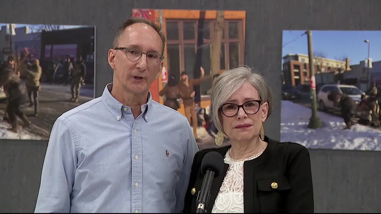 Alex Pretti's parents, Mark and Susan Pretti, at a memorial site in Minneapolis.